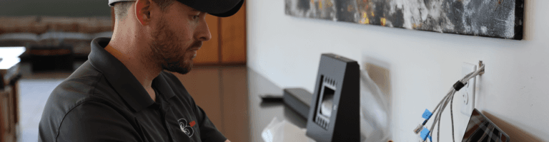 A Bibbeo technician works on installing equipment